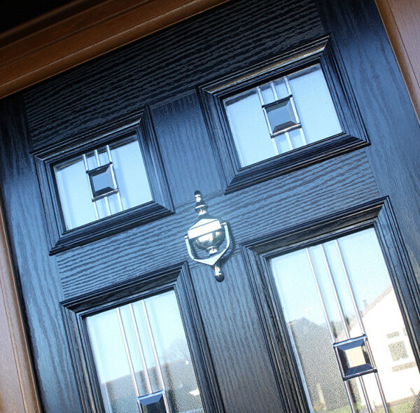 black composite door close up of double glazing